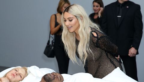 Kim Kardashian went blonde for the exhibition of Kanye's 'Famous' bed of celeb models