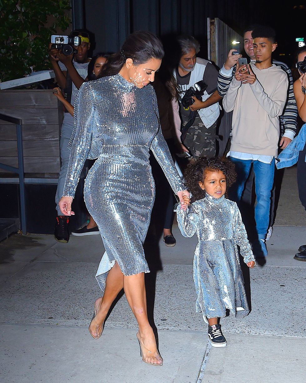 Kim Kardashian and North West wearing matching disco ball dresses