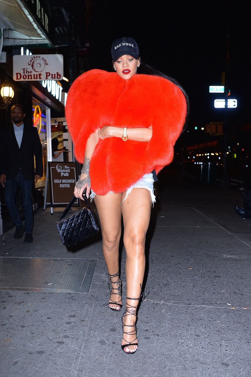 Rihanna wearing a fur heart cape