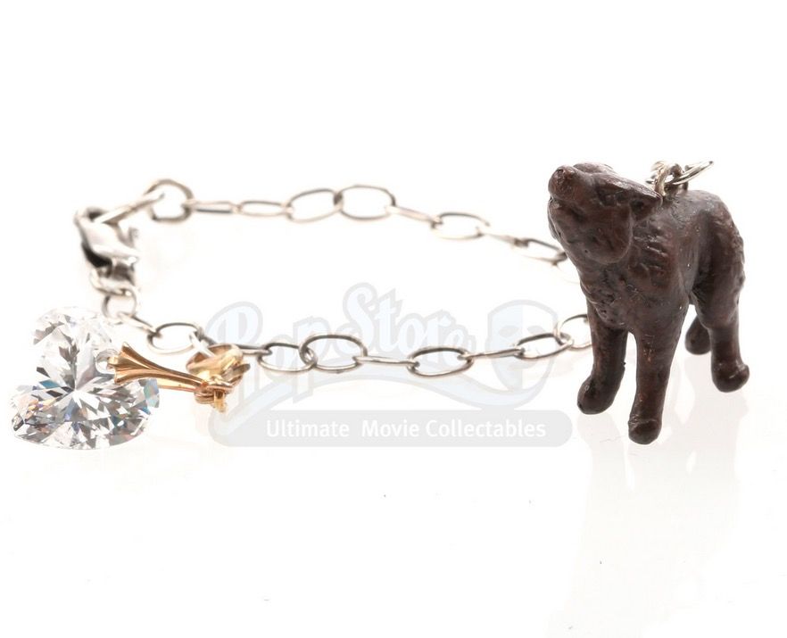 Brown, Toy, Fashion accessory, Jewellery, Chain, Elephants and Mammoths, Working animal, Metal, Body jewelry, Natural material, 