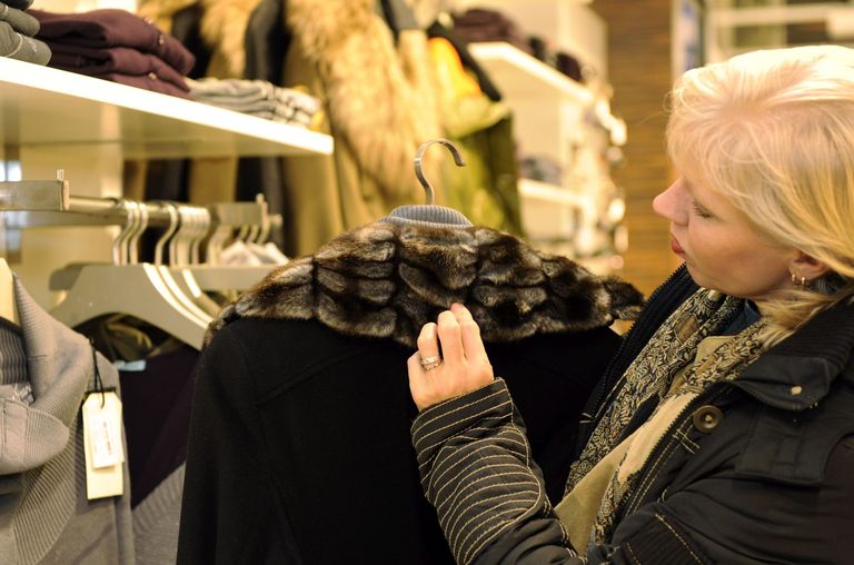Woman looking at a fur collar