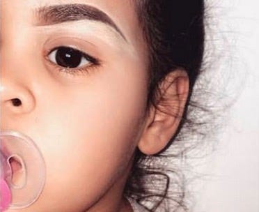 people are freaking out over this 2 year olds drawn on eyebrows