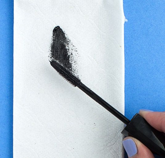 wiping off excess mascara