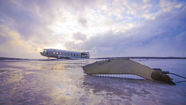 Crashed aircraft after disaster on snowy land under sky · Free