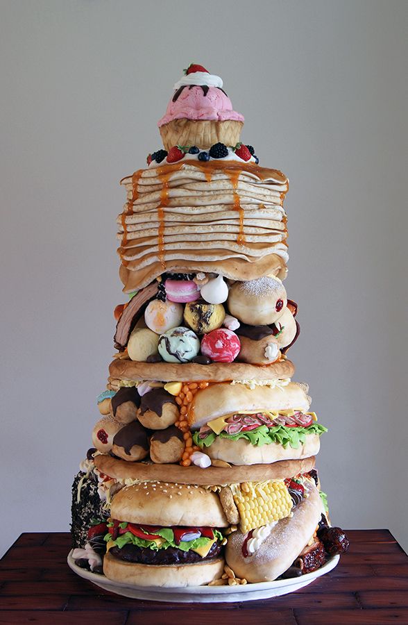 This fast food tower is actually a sweet sponge cake and we're confused AF