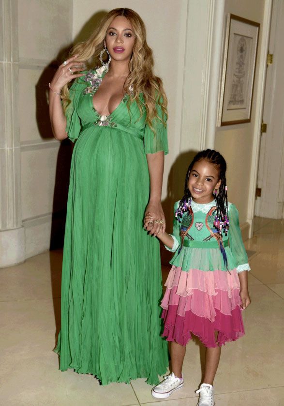 Blue Ivy wearing a custom Gucci dress to the Beauty and the Beast premiere