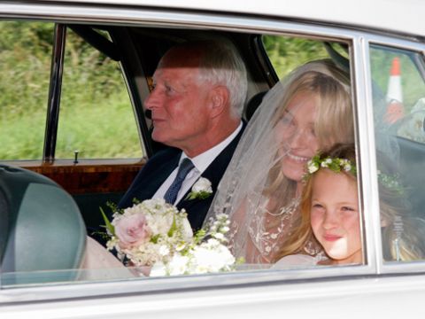 Ensuring she made exactly the right sort of elegant entrance, Kate arrived in a vintage Rolls Royce with her father Peter and daughter Lila Grace