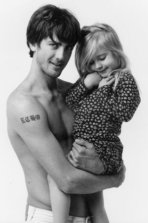 Man holding daughter