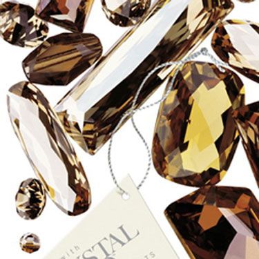 Amber, Font, Gemstone, Body jewelry, Silver, Mineral, Collection, Natural material, Crystal, Still life photography, 