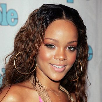 <p>Back in 2005 when Rihanna was a relatively unknown artist she chose a simple centre parting and nicely natural curls for her appearance at the Teen People Listening Lounge. Sweet, girly and not an ounce of attitude about it</p>