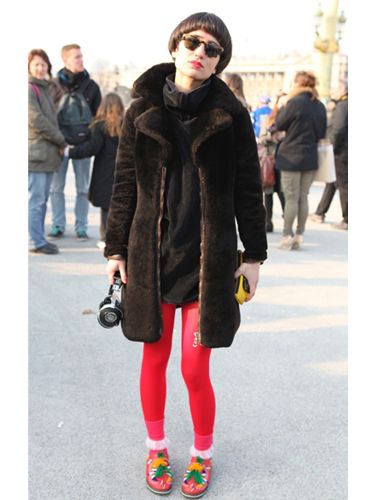 <p>Who wouldn't spot those neon tights? We love this sport luxe look, teaming brights with an oversized sweat and fur coat. Oh and not forgetting the matching pink lipstick</p>


