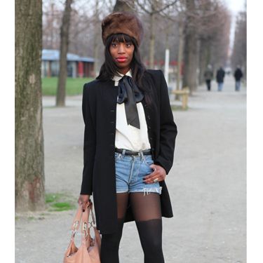 <p>Teaming ripped denim short-shorts with a pussy-bow tie shirt. This lady does smart casual to a tea. We love the fur hat and over-the-knee tights to update the look</p>