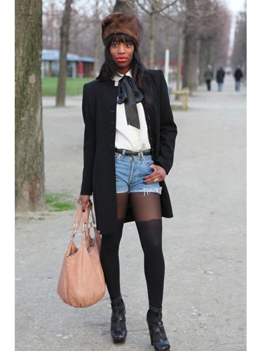 <p>Teaming ripped denim short-shorts with a pussy-bow tie shirt. This lady does smart casual to a tea. We love the fur hat and over-the-knee tights to update the look</p>