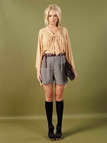 <p>Look sweet and innocent in this peach sheer blouse and high-wasted plaid shorts. Add a satchel and your school girl cool!</p>
<p>Harvey Blouse £20, Jeorgie shorts £18, <a href="http://www.boohoo.com/collections/70s-country-girl/icat/70scountrygirl/"target="_blank">boohoo.com</a></p>