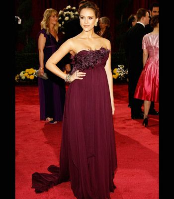 Gorgeous expectant mum Jessica Alba glowed in this trailing plum Marchesa gown, glammed-up with feathers around her front