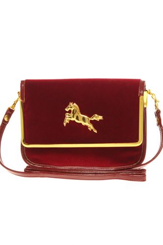 <p><b>Mini</b></p>
<p>Like shorter hemlines after a period of long, the mini handbag makes a refreshing return after seasons of us all carrying hefty oversized totes. The horse motif and red and gold colouring gives this ASOS bag a lovely vintage feel.</p><p>£20, <a href="http://www.asos.com"target="_blank">ASOS</a></p>
