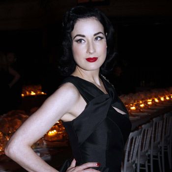 Dita proves red lipstick is vampy not trampy, playing it up against her pale skin.