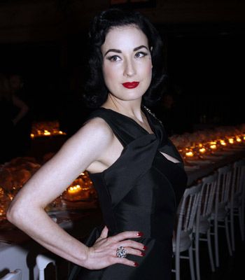 Dita proves red lipstick is vampy not trampy, playing it up against her pale skin.