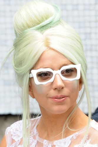 It seems pink hair is already passe - just look at Lady Gaga, always one step ahead, showing off the latest in Halloween-inspired hair shades - Witchy green. 
