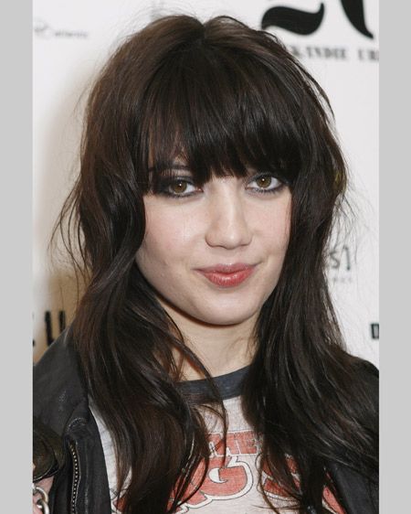 You can tell this girl has a rocker for a dad. Her dark choppy waves and full fringe contrast perfectly with pale skin for maximum effect.  <br />