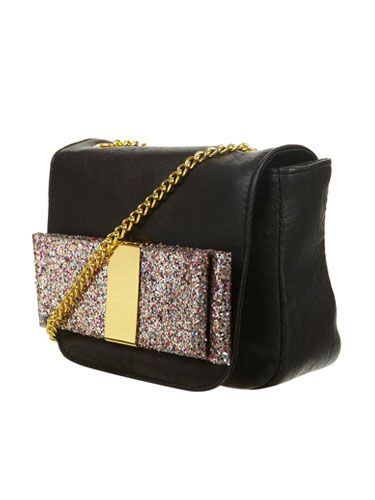 <p>This gorgeous bag is ideal for the party girl in your group. While the classic black colour and hands-free across-body style is very practical, the frivolous, glittery bow panel just screams P-A-R-T-Y!</p> Handbag, £22, <a href="http://www.topshop.com/">Topshop</a>