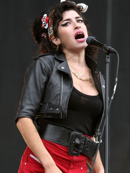 <p>Amy got her fashion act together rocking this cropped zip-front number for a performance at this year's T in the Park</p>