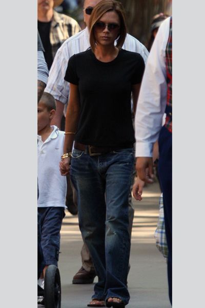 <p>Stop press! Victoria Beckham in baggy jeans, high cut t-shirt <em>and</em> flip-flops? Pinch us, we must be dress-up dreaming</p><p> <br />Image www.splashnewsonline.com  </p>