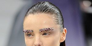 <p>Majestic jewelled brows marked a new era for beauty at Chanel: opulence is going stricter this season. Cobalt blue and emerald green jewels livened up an otherwise flawless and pale complexion.                                                            <br /> </p>