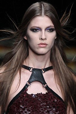 <p>The mood was glam chic with a zest of grunge at Cavalli. The classic smoky eye was revisited with sexy pops of metallic blues, greens, copper and gold to complement a simply tousled middle part.<br /> </p>