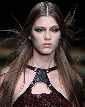 <p>The mood was glam chic with a zest of grunge at Cavalli. The classic smoky eye was revisited with sexy pops of metallic blues, greens, copper and gold to complement a simply tousled middle part.<br /> </p>