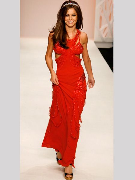 <p>The pop princess revelled on the Fashion For Relief runway in a revealing red dress and tiara </p>