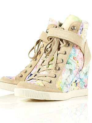 <p>Think the sports luxe trend is for tomboys only? Think again. These pretty floral hi-tops from Toppers have a concealed wedge so you won't have to forfeit your heels, either. Game ON!<br /><br />Floral wedge trainers, £75, <a title="http://www.topshop.com/webapp/wcs/stores/servlet/ProductDisplay?beginIndex=0&viewAllFlag=&catalogId=33057&storeId=12556&productId=5469797&langId=-1&sort_field=Relevance&categoryId=277012&parent_categoryId=208491&pageSize=200" href="http://www.topshop.com/webapp/wcs/stores/servlet/ProductDisplay?beginIndex=0&viewAllFlag=&catalogId=33057&storeId=12556&productId=5469797&langId=-1&sort_field=Relevance&categoryId=277012&parent_categoryId=208491&pageSize=200" target="_blank">Topshop</a></p>