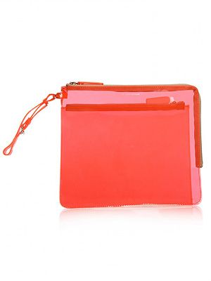 <p>Not only is this perspex pouch pretty practical in soggy climes, but super stylish, too. The fluro hue and sleek exterior are spot on this season - plus, you'll be able to see all your bits at a glance, too. Win!<br /><br />Perspex pouch, £35, <a title="KG Kurt Geiger" href="http://www.kurtgeiger.com/women/accessories/bags/perspex-xl-pouch-2.html" target="_blank">KG Kurt Geiger</a></p>