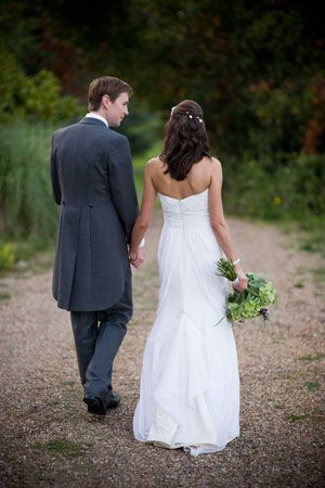 Clothing, Dress, Coat, Trousers, Petal, Photograph, Standing, Bridal clothing, Outerwear, Suit, 