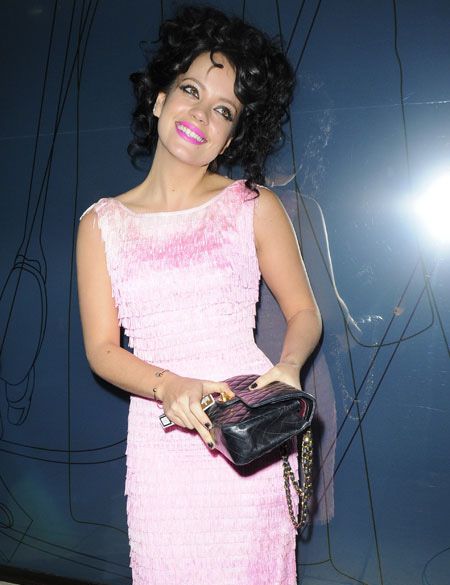 We barely recognised Lily Allen in this pink cocktail dress with matching fuchsia pink lips and a head full of curly hair! The singer smiled sweetly for the cameras (which also made her look different!) as she attended the GQ bash at St Albans in Regent Street, London.  <br />