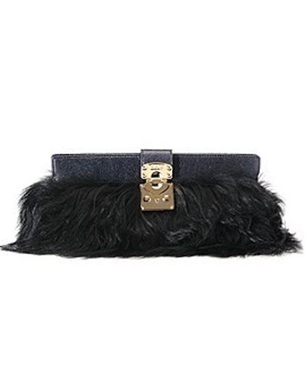 Fabrics with fringing and feathers will be on every fashionista's wish list, so treat her to this long-haired faux fur clutch and she'll be in accessory heaven. The clutch from <a target="_blank" href="http://www.harrods.com">www.harrods.com</a> is finished with a glossy patent leather and golden clasp - perfect for parading with a knockout dress.  <br />
