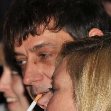 Kate Moss and Jamie Hince were sporting matching cuts and bruises on their faces as they helped turn on the Christmas lights at the Stella McCartney boutique in Chelsea. They couple were keen to hide their minor wounds from the paparazzi (Jamie had one impressive black eye) and buried their faces in one another's arms as an unfazed Stella looked on...  <br />
