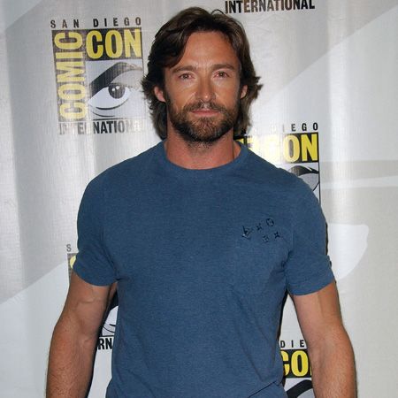 Oozing masculinity in this casual combo of blue top and rugged locks, Hugh channels his inner Wolverine who he played in the X-Men movie in 2000. If only he'd rescue us!  <br />