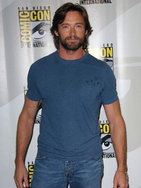Oozing masculinity in this casual combo of blue top and rugged locks, Hugh channels his inner Wolverine who he played in the X-Men movie in 2000. If only he'd rescue us!  <br />