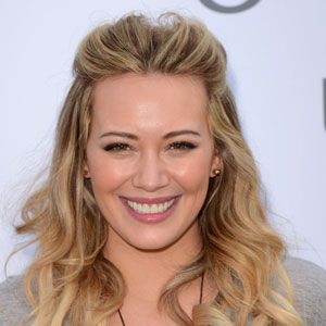 <p>Curls don't have to be wham, bam, gorgeous and glam, we like them nice and natural too and you can't go wrong with Hilary Duff's flowing curls. Quiffing your hair at the front and smoothing it back means there's no need to deal with roots and is great for disguising grease too while the rest of her hair has been loosely tongued to create a summer finish that you could easily eek out for two days.</p>
<p><strong>Top Tip:</strong> If you're curling your hair with a tong, only rough dry your hair otherwise it will be too smooth and won't hold as well</p>