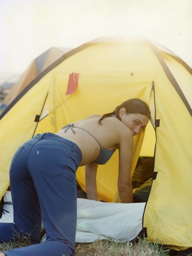 Yellow, Tent, Camping, Style, Outdoor recreation, Elbow, People in nature, Denim, Tints and shades, Tarpaulin, 