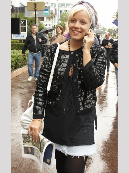 Lily teamed a denim skirt with a sequined cardi and vintage head scarf out and about at the Cannes Film Festival. Is this a look only Lil' can pull off?  <br />