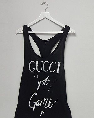 <p><span lang="EN-US">We're getting our urban swag on this season! Designed by Simeon Farrar, this tongue-and-cheek monochrome slogan T-shirt is an absolute must-have. </span></p>
<p>Gucci Got Game Vest, £45, <a href="http://www.3939shop.com/products/black-score-gucci-t-shirt" target="_blank">3939 Shop London </a></p>