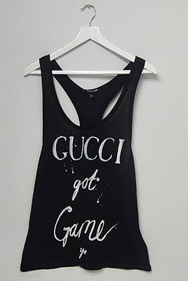 <p><span lang="EN-US">We're getting our urban swag on this season! Designed by Simeon Farrar, this tongue-and-cheek monochrome slogan T-shirt is an absolute must-have. </span></p>
<p>Gucci Got Game Vest, £45, <a href="http://www.3939shop.com/products/black-score-gucci-t-shirt" target="_blank">3939 Shop London </a></p>