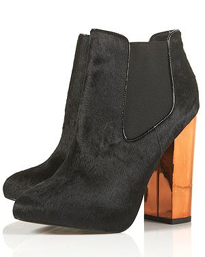 <p>It's officially winter, and you know what that means. Kicking back and relaxing with a hot cuppa. There's no better way to accessorise this season than with a pair of black pony-inspired heels to remind you of the countryside up north.</p>
<p>Alcatraz Electric Heel Boots, £78, <a href="http://www.topshop.com/webapp/wcs/stores/servlet/ProductDisplay?beginIndex=1&viewAllFlag=&catalogId=33057&storeId=12556&productId=8070144&langId=-1&sort_field=Relevance&categoryId=208544&parent_categoryId=208492&pageSize=200" target="_blank">Topshop</a></p>