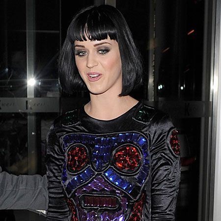 Katy Perry arrived back at her hotel after a show stopping performance at Camden's KOKO in this bizarre jewel-encrusted top and wet look leggings...  <br />