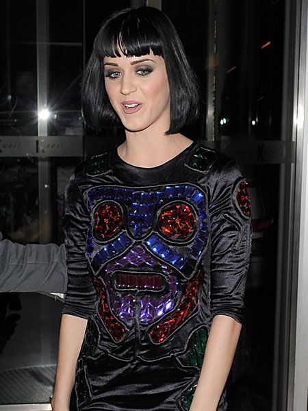 Katy Perry arrived back at her hotel after a show stopping performance at Camden's KOKO in this bizarre jewel-encrusted top and wet look leggings...  <br />