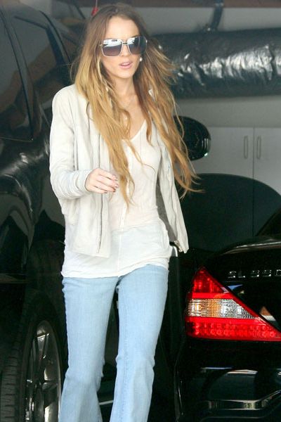 Lindsay Lohan still looks worryingly underweight in a pair of flares and wedges as she arrived at the Chateau Marmont in LA. The actress has just returned to the US after a stay in London where she attended Sam Ronson's brother's Bar Mitzvah.  <br />