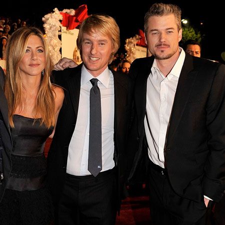 With his <em>Marley & Me</em> co-stars, Jennifer Aniston and Owen Wilson, Eric smoulders for the paps on the red rug. Is he Hollywood's newest hottie?  <br />