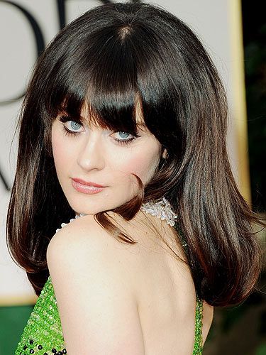 We eagerly awaited Zooey Deschanel Golden Globes look and she didn't disappoint. Zooey went for a 50s vibe with a thick feline flick, big lashes, nude lip and full bodied hair - Bardot chic